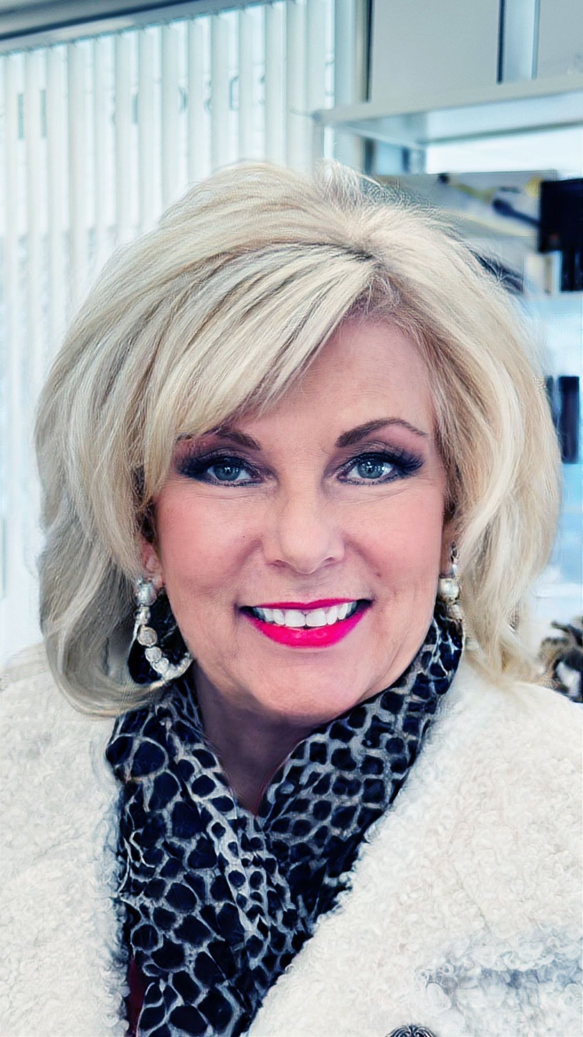 Platinum blonde full hair color result with layered bob at HB Beauty Waterloo — professional color transformation