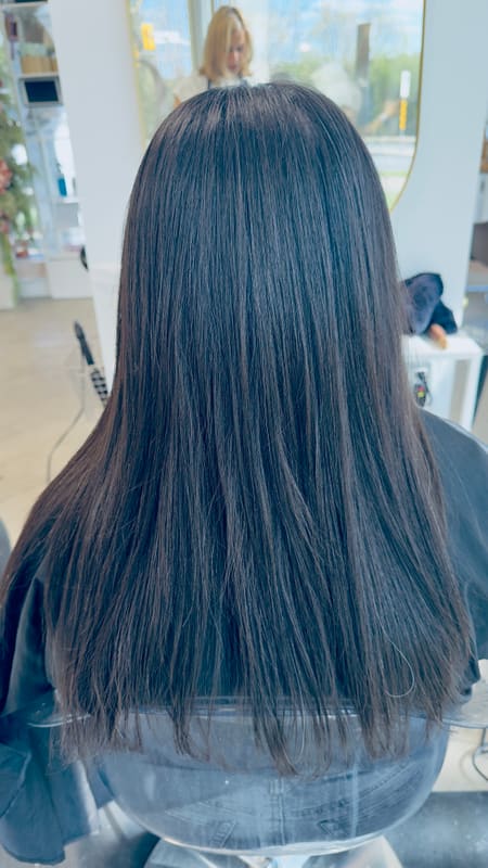 Smooth, straight dark hair after a keratin treatment